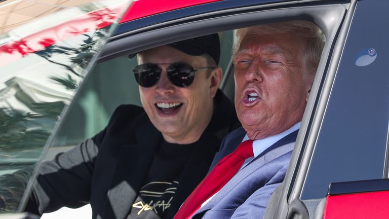 U.S. President Donald Trump and Tesla CEO Elon Musk sit in a Tesla car model S, in front of the White House in Washington, D.C., U.S., March 11, 2025. REUTERS/Kevin Lamarque
