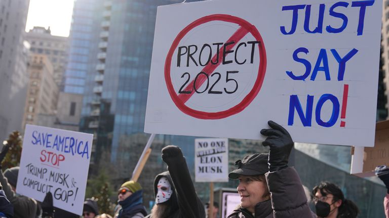 Protesters demonstrate against Project 2025, in Philadelphia, Wednesday, Feb. 5, 2025. (AP Photo/Matt Rourke)