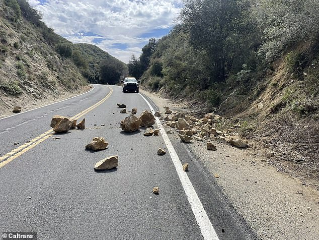 The California Department of Transportation shared images of rocks that fell on State Route 76 just east of E Grade Road and warned drivers to watch out for obstacles on Monday