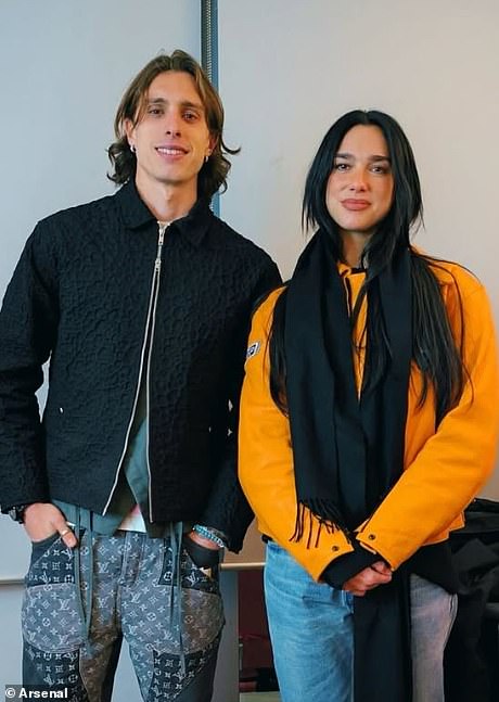 Dua Lipa pictured with Arsenal defender Riccardo Calafiori after the 3-0 Real Madrid win