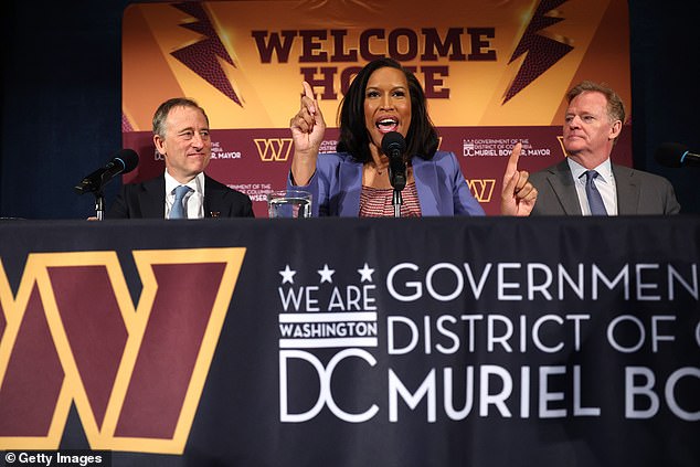 DC Mayor Muriel Bowser (center) announces the planned construction of the stadium