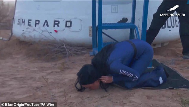 After stepping out of the capsule, Katy Perry (pictured) kissed the ground