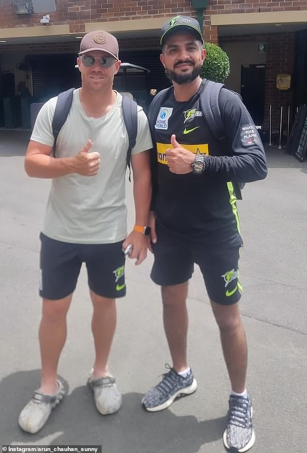 Following the chaotic scenes, the match was abandoned and both teams were disqualified from the competition (Arun Chauhan is pictured right, with Aussie cricket star David Warner)