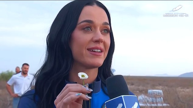 Katy Perry was one of the first to exit the New Shepard spacecraft and immediately kissed the dirt at the Texas landing site