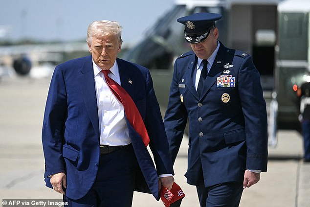 President Donald Trump make his way to board Air Force One before departing from Joint Base Andrews in Maryland