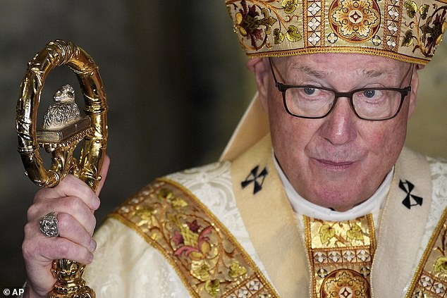 Cardinal Timothy Dolan speaks to reporters following a mass for the late Pope Francis
