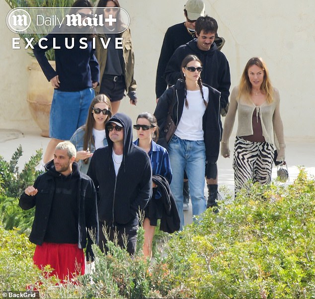 The couple walked with a group of their friends from the seaside restaurant Casa Jondal.
