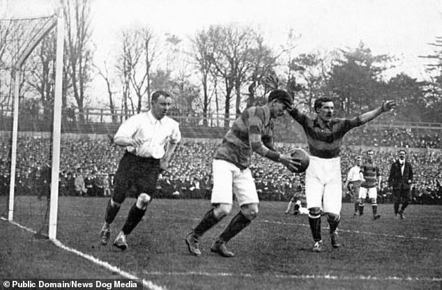 An early England vs Scotland game held at Crystal Palace in London on the 1st April 1905. Here the Scotland goalkeeper J Lyall (centre) can be seen preparing to kick the ball downfield during the match which England won 1-0