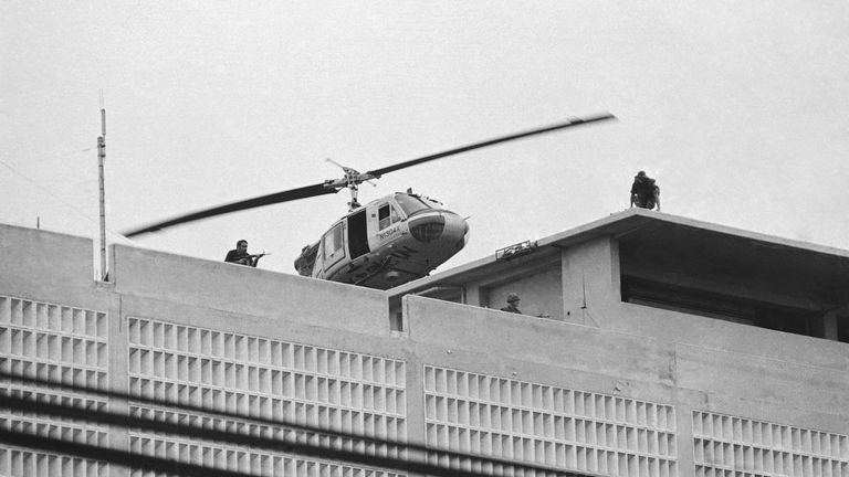 A US navy helicopter prepares to evacuate the last remaining staff at the US embassy in Saigon as America pulls out of South Vietnam on 30 April  1975. Pic: AP