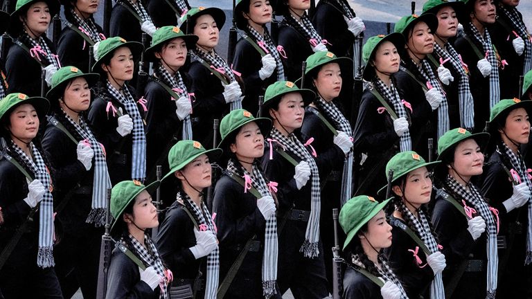 Female soldiers in North Vietnamese Army costumes march during a parade celebrating the 50th anniversary of the end of the war on Wednesday, April 30, 2025, in Ho Chi Minh City, Vietnam. (AP Photo/Richard Vogel)