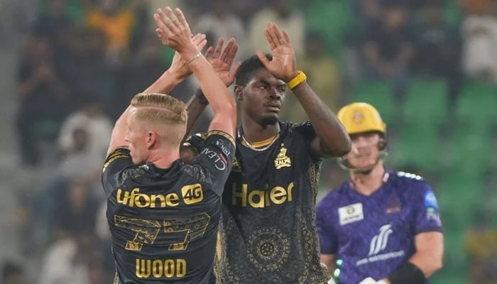 Peshawar Zalmis Alzarri Joseph celebrates with Luke Wood after dismissing Quetta Gladiators Faheem Ashraf (unpictured) during their PSL 10 match at the Gaddafi Stadium in Lahore on April 27, 2025. — PCB
