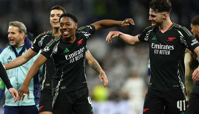 Arsenals Myles Lewis-Skelly and Declan Rice celebrate after the match in Champions League quarter final second leg against Real Madrid at Santiago Bernabeu in Madrid on April 16, 2025. — Reuters