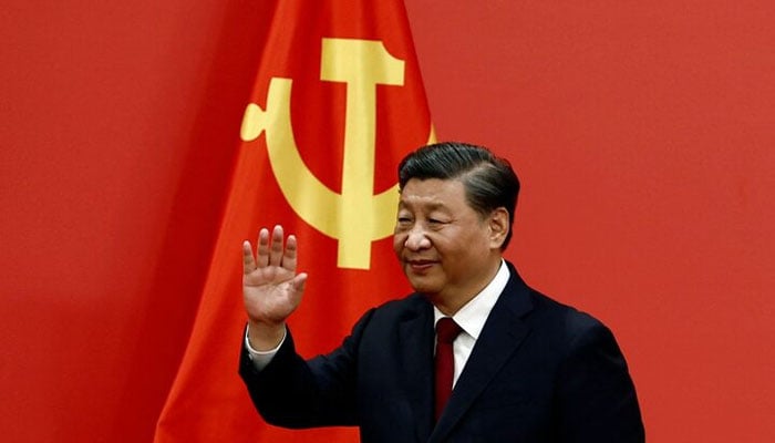 Chinese President Xi Jinping waves after his speech as the new Politburo Standing Committee members meet the media following the 20th National Congress of the Communist Party of China, at the Great Hall of the People in Beijing, China October 23, 2022. — Reuters