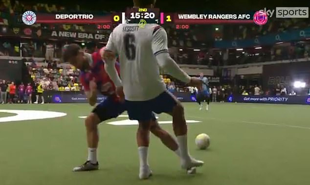 Joleon Lescott (in white) was tackled by Domingos Pires (in red and blue) during a flashpoint in Monday's Baller League
