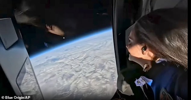 The footage captured filmmaker Kieranne Flynn staring out the window at a Earth stunningly glowing in the blackness of space