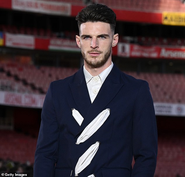 Arsenal and PSG aren't just battlling on the pitch - they're competing to be the world's most fashionable club (pictured: Declan Rice at London Fashion Week)