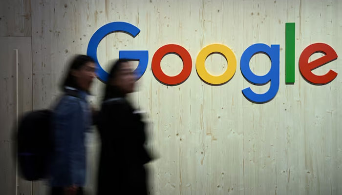 People walk next to a Google logo during a trade fair in Hannover Messe, in Hanover, Germany, April 22, 2024. — Reuters
