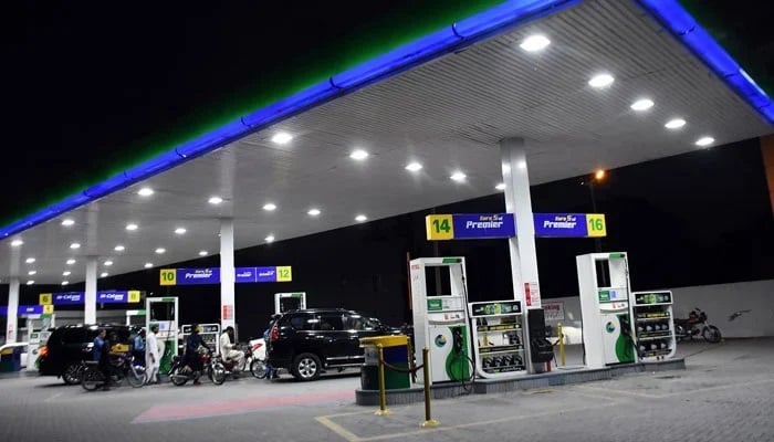 Consumers buy fuel at a petrol station. —APP/File