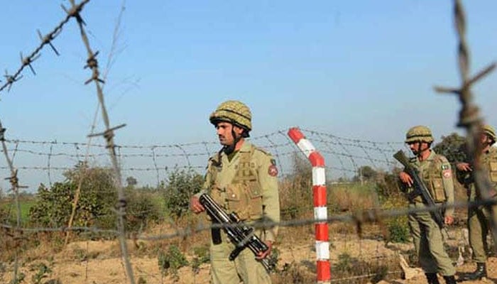 In this file photo, personnel of Pakistan Rangers patrol along the Line of Control. — AFP/File