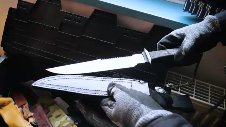 The elite unit has taken over 250 knives off of Manchester's streets - an officer holds one of the knives recovered that he describes as a 'rambo' blade