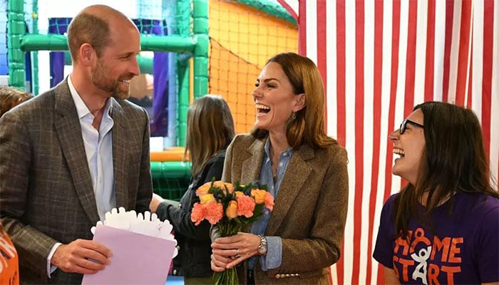 Prince William and Princess Kate surprised with a card and bouquet of flowers.