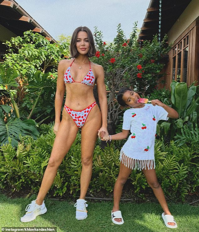 Khloé Kardashian sent fans into a frenzy with her killer new bikini body in an Instagram snap she shared on Monday (pictured with daughter True)