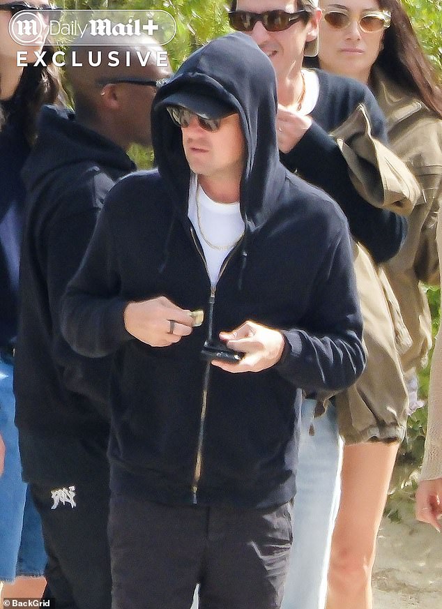 DiCaprio went incognito for an outing with his girlfriend and friends in Ibiza, where he hid a noticeably slimmer frame beneath a black zip-up.