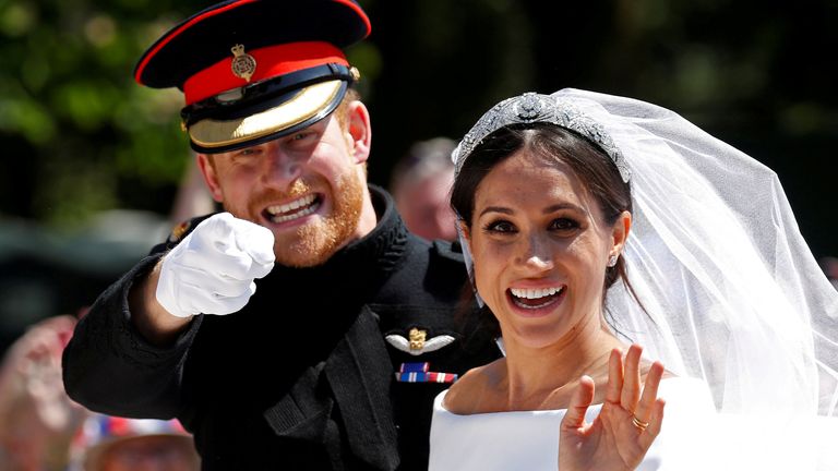 Britain's Prince Harry gestures next to his wife Meghan as they ride a horse-drawn carriage after their wedding ceremony at St George's Chapel in Windsor Castle in Windsor, Britain, May 19, 2018. Picture taken May 19, 2018. REUTERS/Damir Sagolj/File Photo SEARCH "POY DECADE" FOR THIS STORY. SEARCH "REUTERS POY" FOR ALL BEST OF 2019 PACKAGES. TPX IMAGES OF THE DAY.