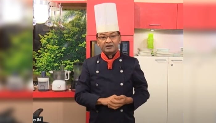 Chef Zakir Hussain can be seen during a cooking show in this still taken from a video. — Screengrab/YouTube/Imrose Inayat