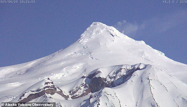 Mount Spurr is now steaming from its summit crater as scientists warn it is 'moving closer to an eruption'