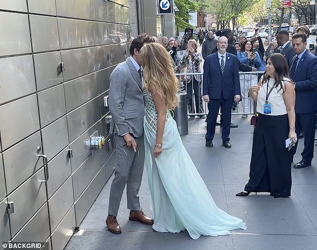 James added: 'Blake and Ryan complete the trio of iconic poses with this third stalwart 'Whispered secrets' pose outside in the street. This is a favorite pose among celeb couples wanting to look flirtatious together for the cameras'