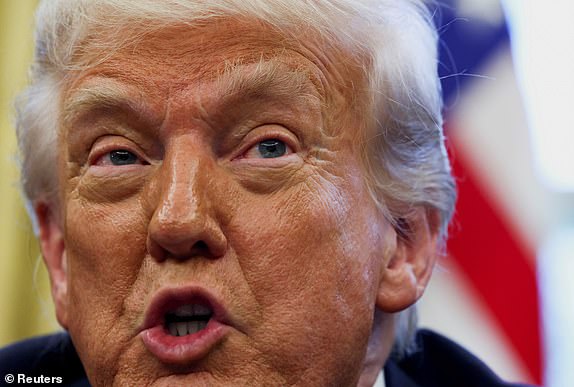 FILE PHOTO: U.S. President Donald Trump speaks on the day he signs executive orders in the Oval Office at the White House in Washington, D.C., U.S., April 17, 2025. REUTERS/Evelyn Hockstein/File Photo
