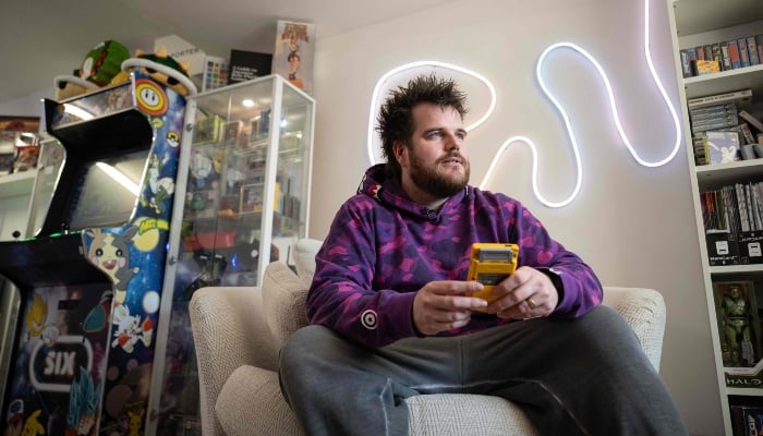 Luke Malpass, the owner and founder of RetroSix, poses for a photograph in their headquarters in Stoke-on-Trent, England, on April 1, 2025. —AFP