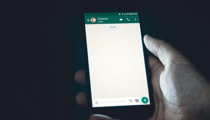This representational image shows a WhatsApp chat. — Unsplash