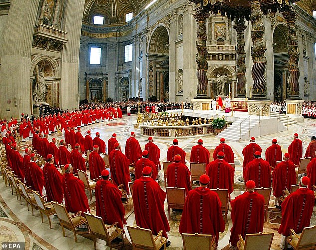 Once the election begins, the cardinals will remain in the Vatican until a new pope is chosen by a two-thirds majority. Pictured: Cardinals at morning Mass in St. Peter's Basilica, Vatican City, in 2005 before sequestering themselves in the Sistine Chapel for the beginning of the conclave to elect a new pope
