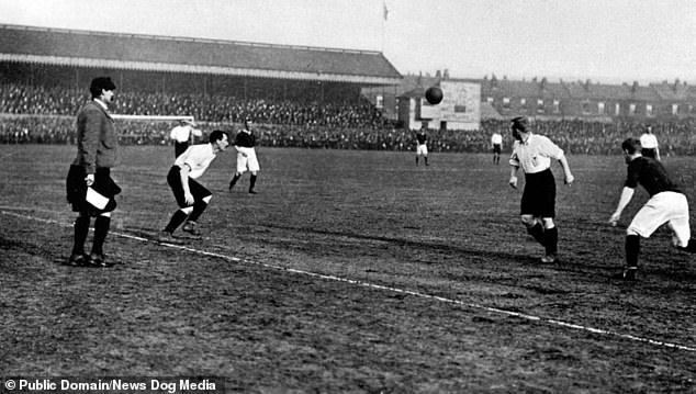 A linesman in pantaloons marshals the game as England play Scotland at Bramall Lane, Sheffield in 1903. Scotland won the game 2-1