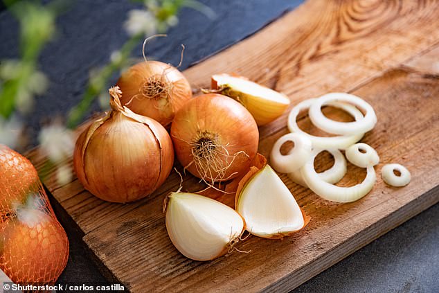 Experts say you may have been storing your onions wrong, as they reveal why you should never put them in the fridge (stock image)