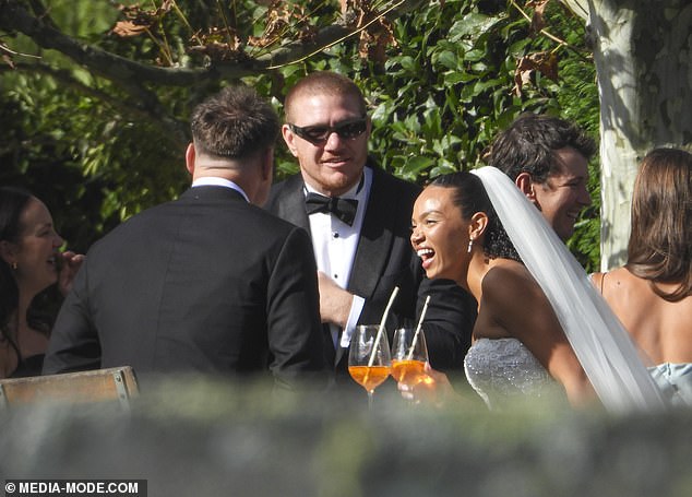 The pair were married at the Krinklewood Estate in New South Wales, and celebrated the day with an Aperol Spritz alongside several big names from the NRL World (pictured, Esegbona right alongside ex-Roosters star Dylan Napa, centre)