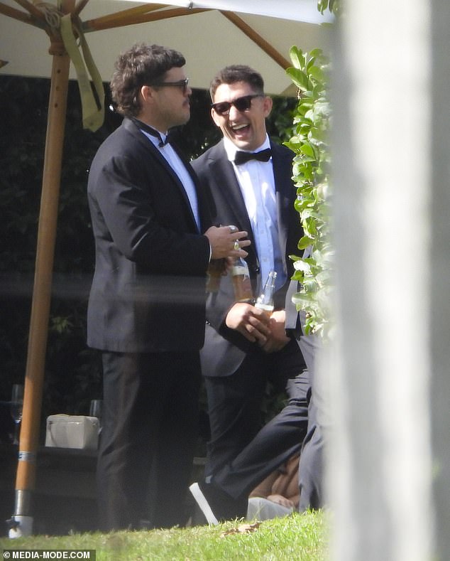 England star and Roosters loose forward Victor Radley (right) laughed and smiled as he enjoyed a beer in the sunshine with other members of the wedding party