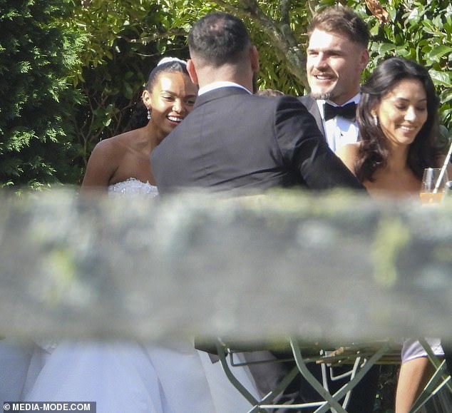 The happy couple beamed from ear to ear as they mingled with guests at the wedding reception
