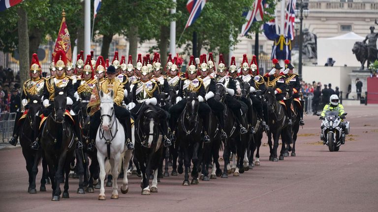 Members of the Household Cavalry Mounted Regiment pass down the Mall ahead of the VE Day 80th anniversary parade in London, Monday, May 5, 2025. (AP Photo/Alberto Pezzali, Pool)