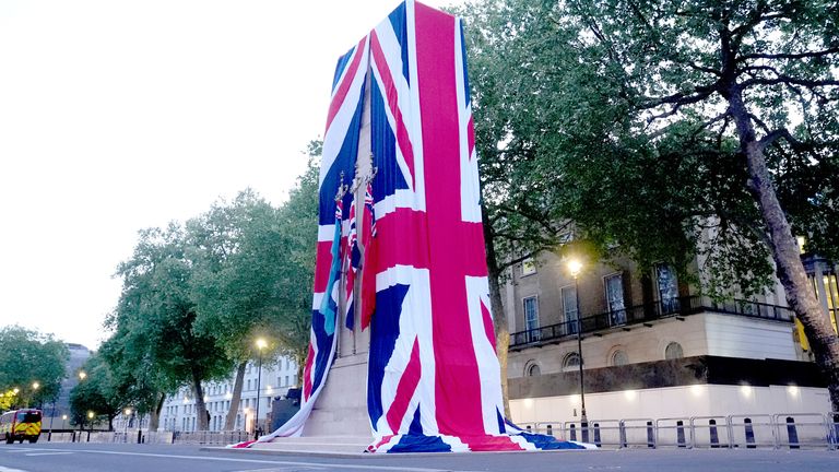 The Cenotaph on Whitehall is dressed in the Union flag ahead of a military procession marking the 80th anniversary of VE Day.
Pic: PA