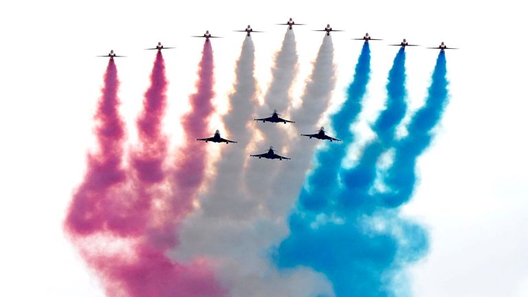 The military flypast passes over The Mall and Buckingham Palace.
Pic: PA