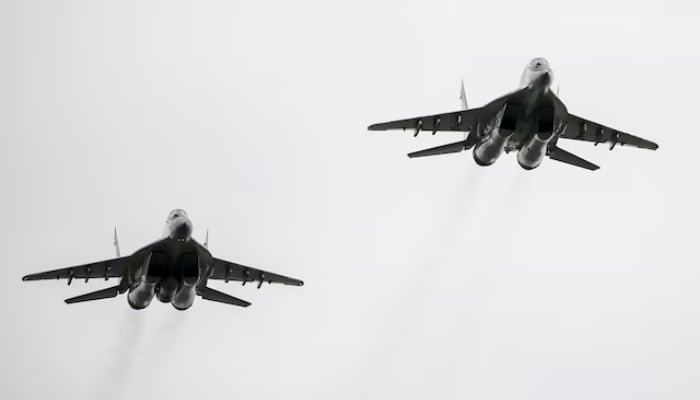 MIG-29 fighter aircrafts fly at a military air base in Vasylkiv, Ukraine, August 3, 2016. — Reuters