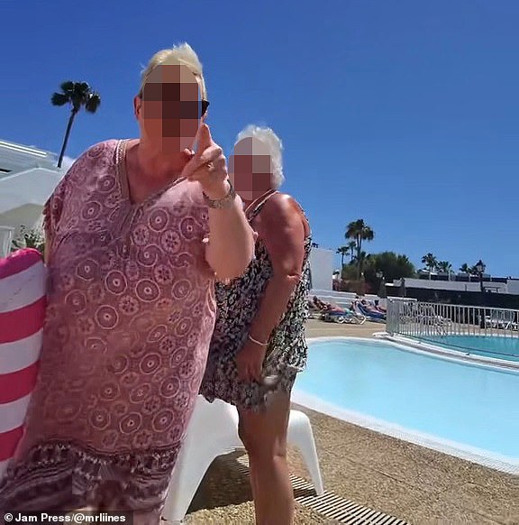 The woman in pink hits back at Mr Lines as he repeatedly shouts 'Karen' while filming her