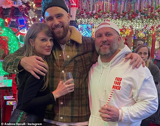 Kelce and Swift pictured alongside his personal trainer, Andrew Spruill, last December