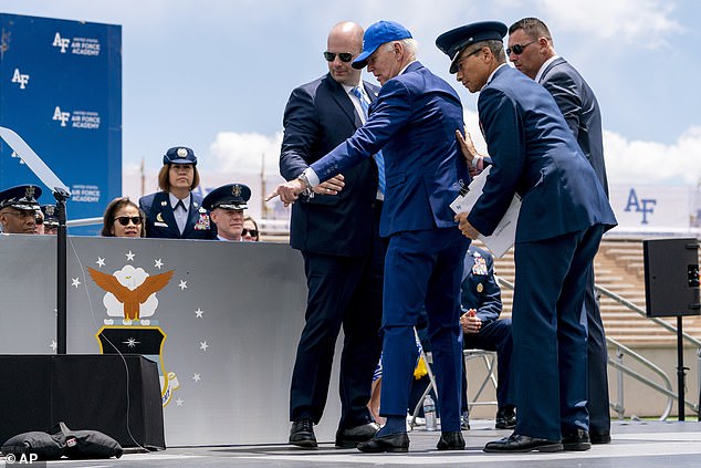 The then-president pointed to sandbags that he fell over during the commencement