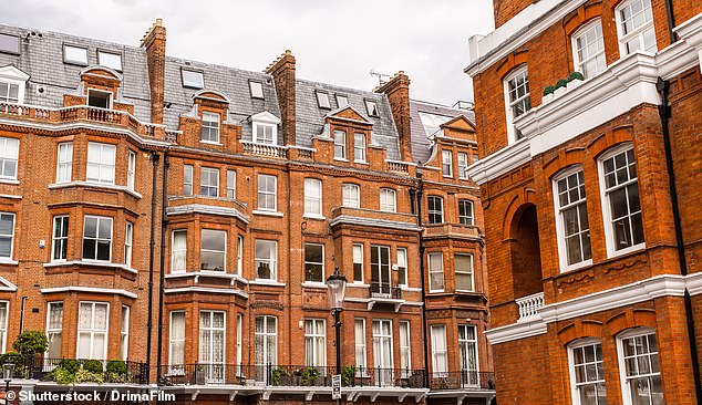 Kensington and Chelsea house prices are down 28.5 per cent since October 2021. Pictured: Terraced flat in red bricks in Chelsea