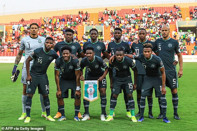 Aina (second left front row) said the Forest squad are praying for Awoniyi (second left top row)