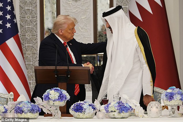 Trump shaking hands with Emir of Qatar Tamim bin Hamad al Thani